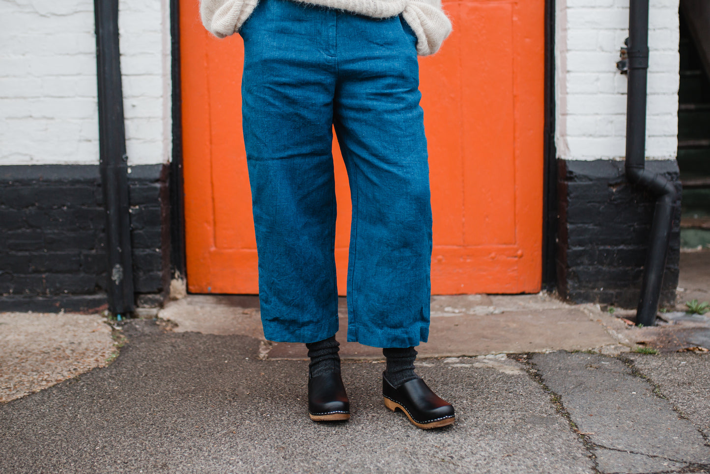 Onyx black classic style swedish clog with a covered back and a low heel