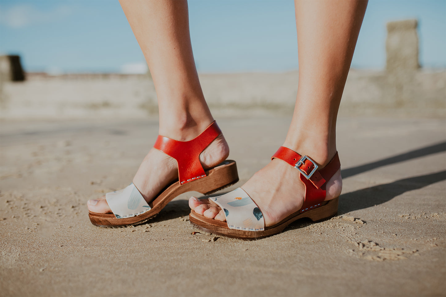 girl wears handpainted brandy clog sandals