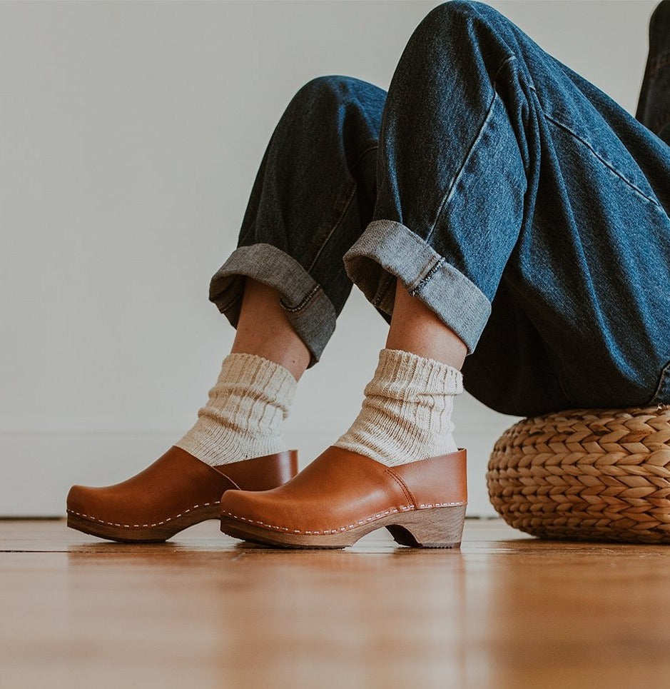 girl wears denim jumpsuit with organic, recycled cotton socks in a cream colour with a ribbed ankle with Cumin Low Jord clogs
