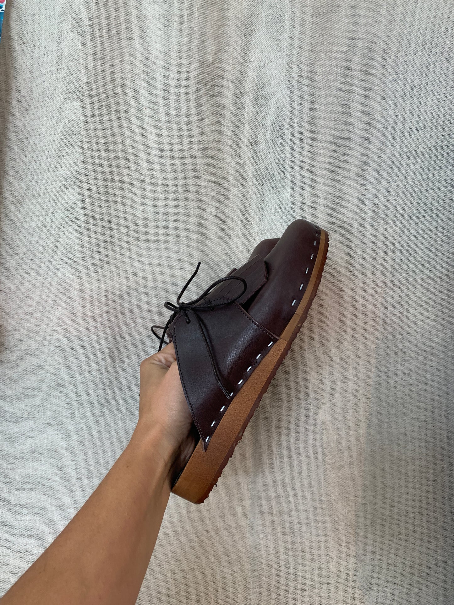 brown leather lace up clog mules with removable fringe tongue and flexible wooden base