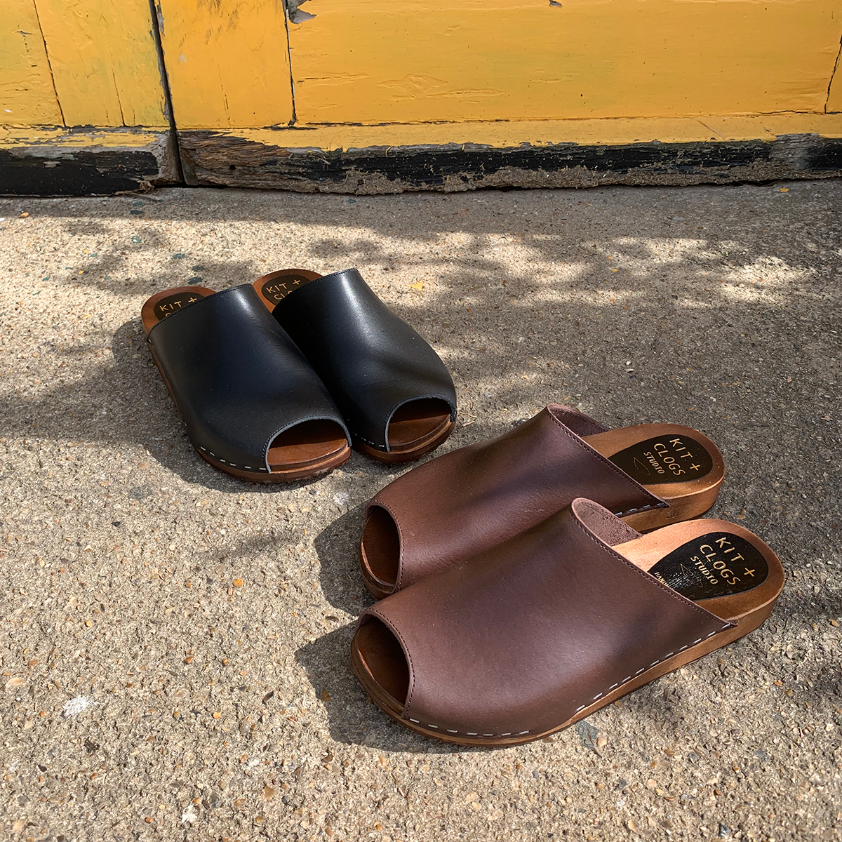 Onyx black flex base peep toe clogs sandals