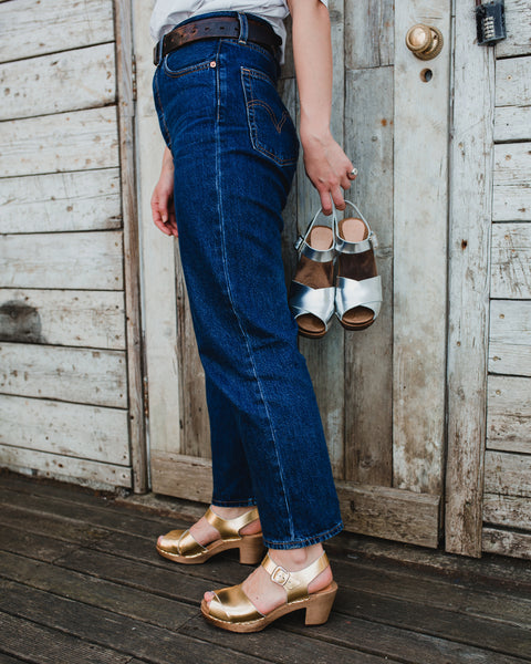 silver metallic cross over mid heel sandal clog with ankle strap