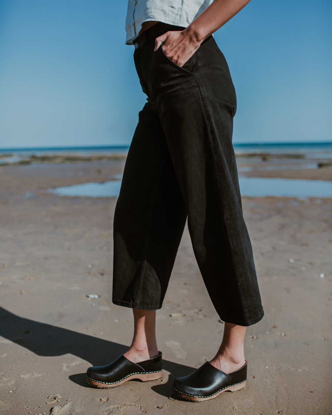 Onyx black classic style swedish clog with a covered back and a low heel