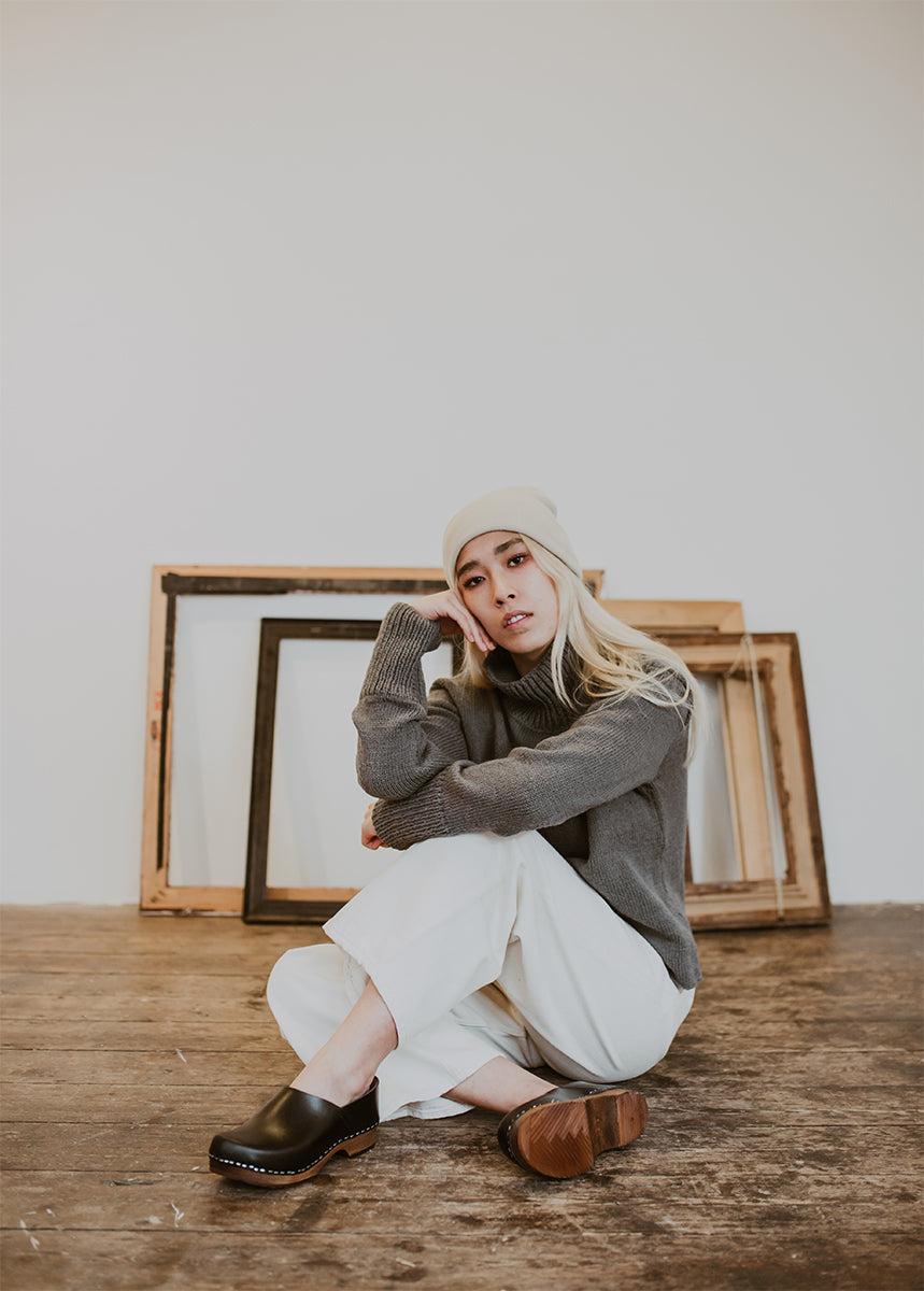 Girl wears winter wear with onyx low heel clog shoe