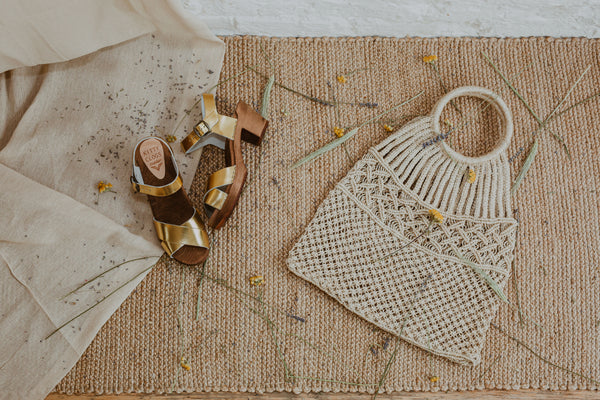 Gold metallic cross over sandal clog with ankle strap and a mid heel bridal