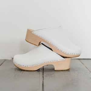 white womens swedish clog mules with a light mid heel