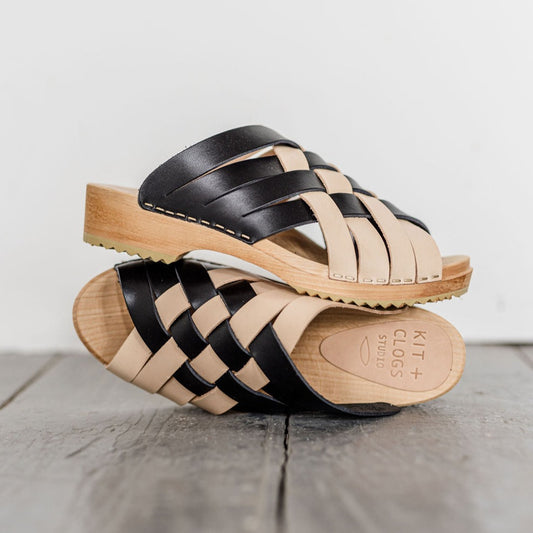 two tone natural and black woven leather slip on clog sandals