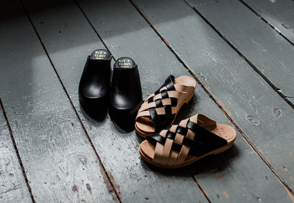 two tone natural and black woven leather slip on clog sandals
