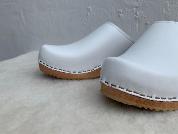 Ice white low classic style swedish clog mules with light wooden base