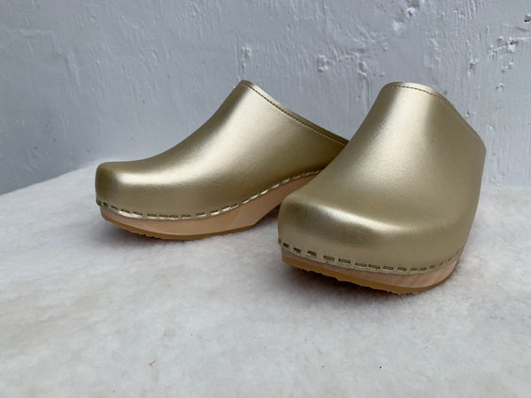 Gold classic style swedish clog with slight heel and light coloured wooden base