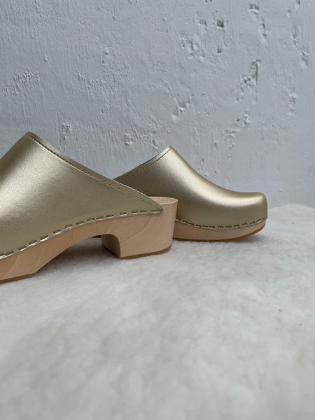 Gold classic style swedish clog with slight heel and light coloured wooden base