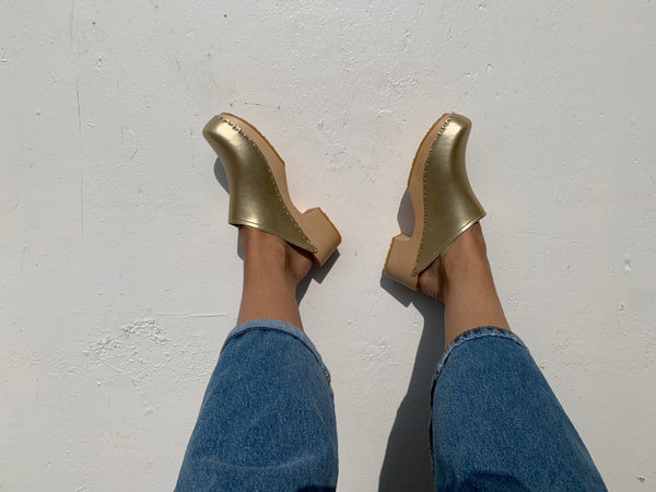 Gold classic style swedish clog with slight heel and light coloured wooden base