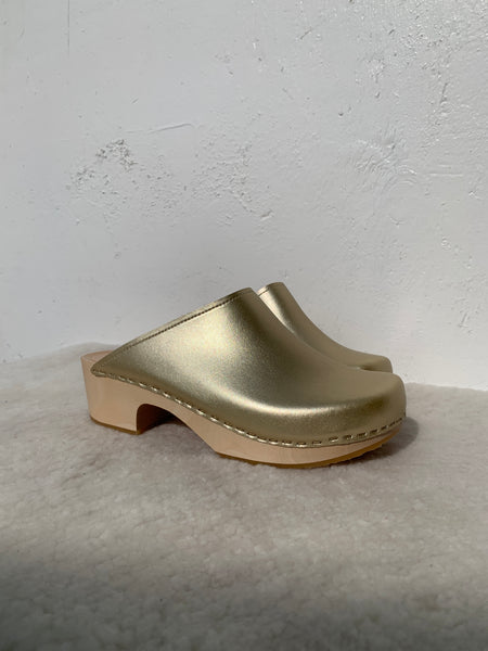 Gold classic style swedish clog with slight heel and light coloured wooden base