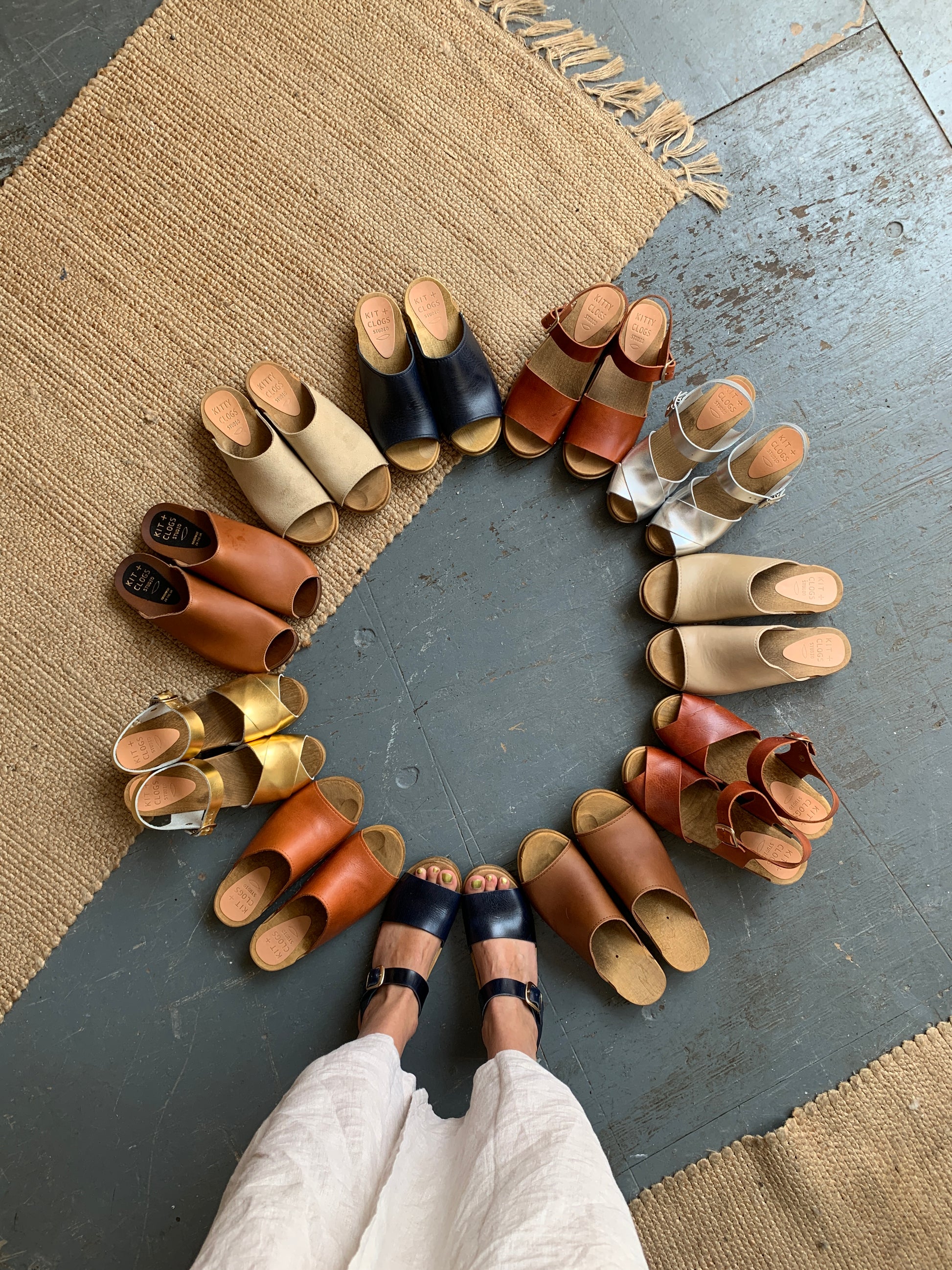 Navy blue clog sandal with ankle strap