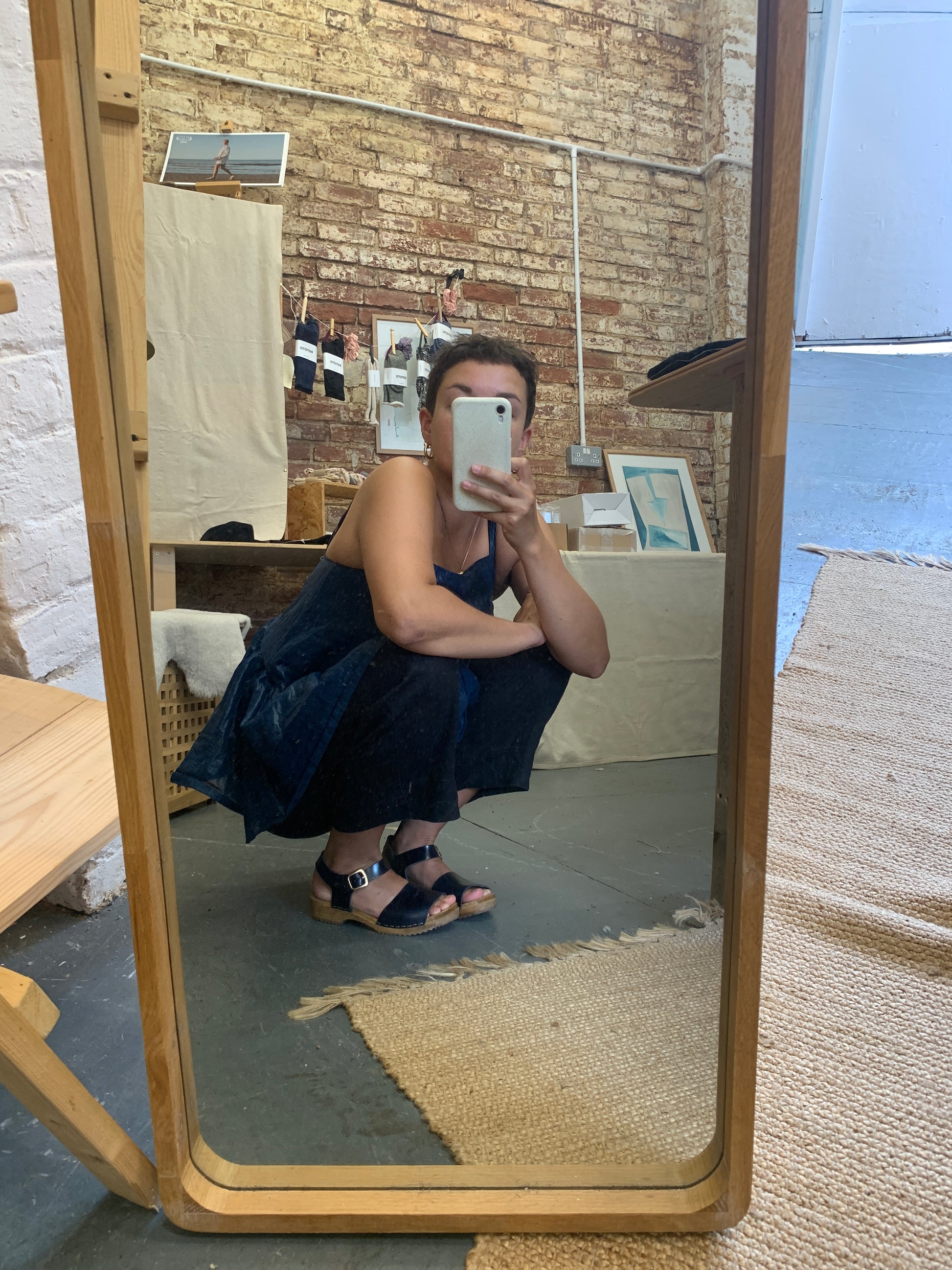 Navy blue clog sandal with ankle strap