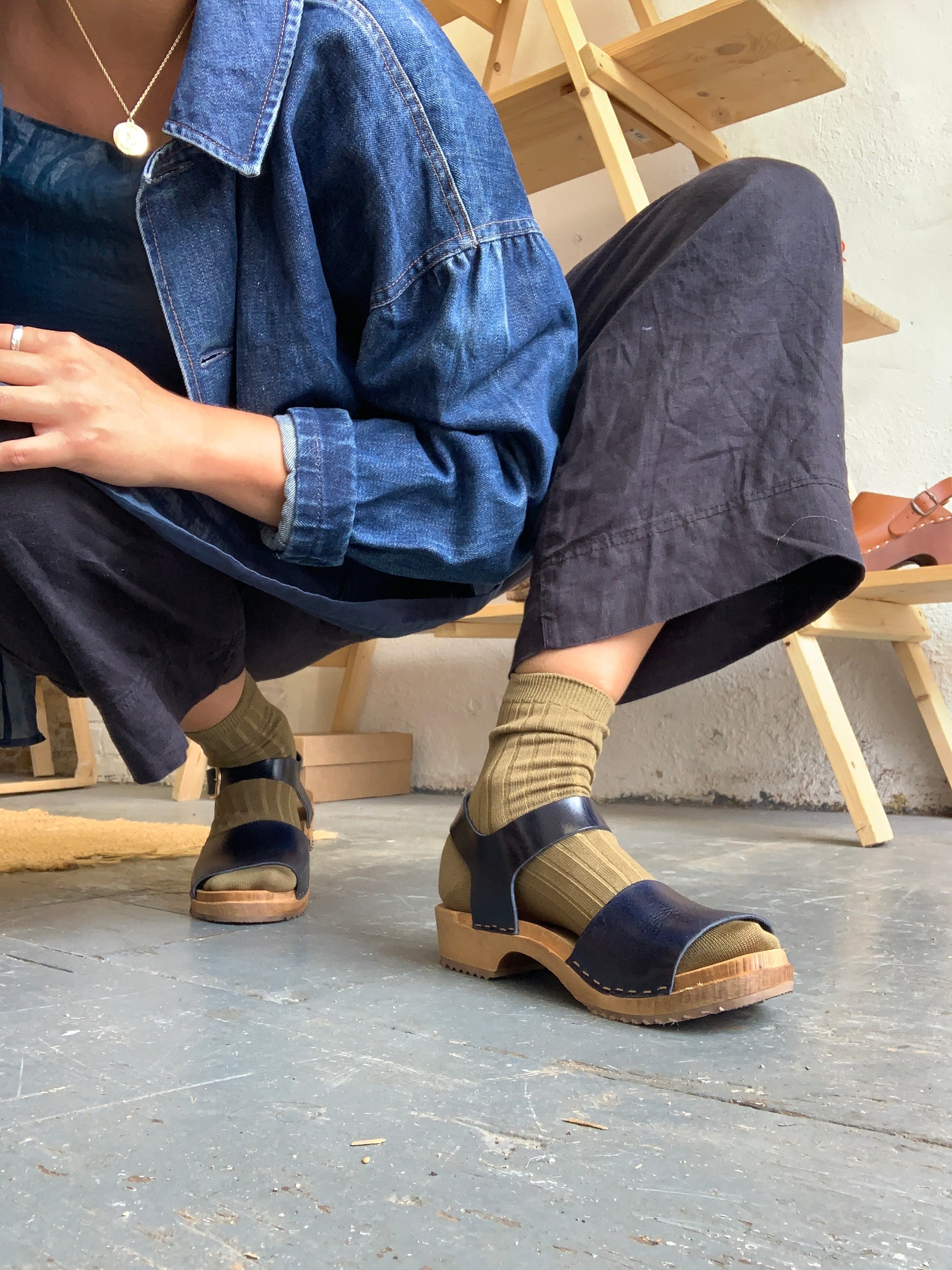 Navy blue clog sandal with ankle strap