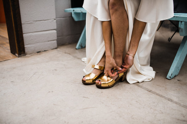 gold metallic cross over mid heel sandal clog with ankle strap bridal