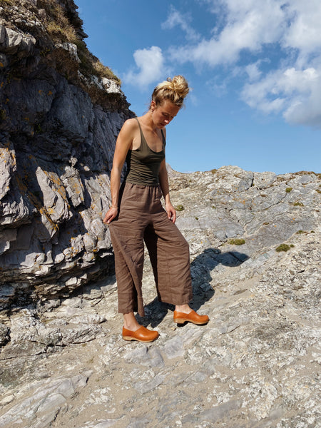 Cumin tan swedish clogs with a low wooden base and covered back