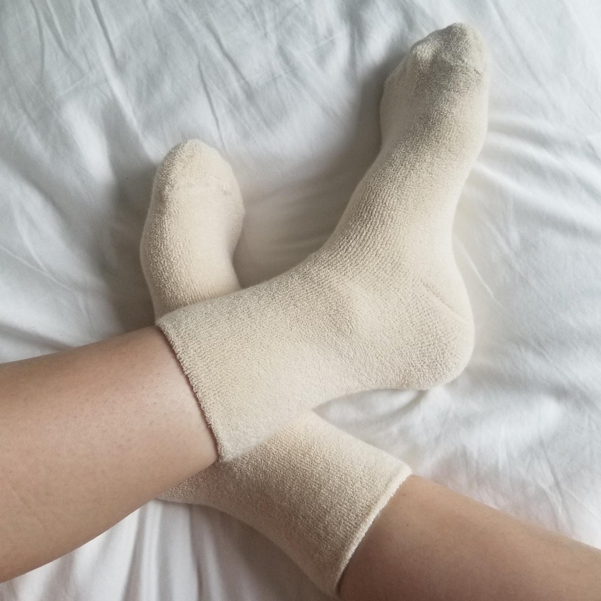 cosy cream ankle length terry cotton socks on feet