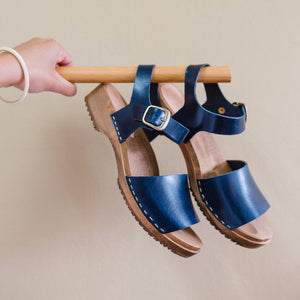 Navy blue clog sandal with ankle strap