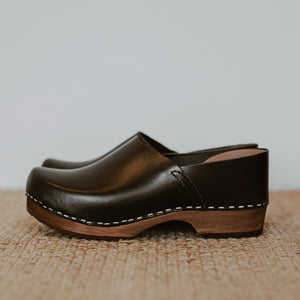 Onyx black classic style swedish clog with a covered back and a low heel