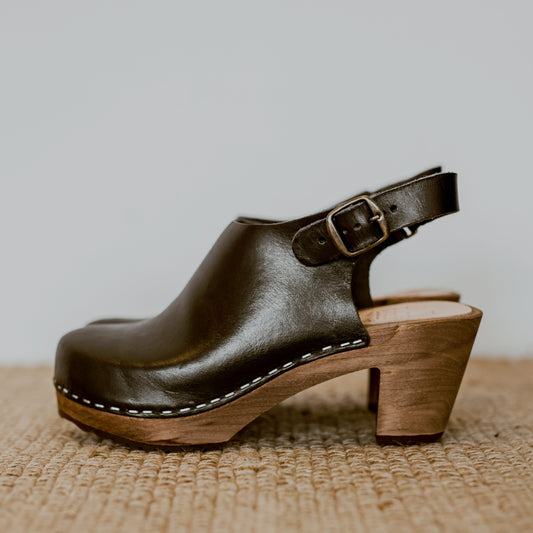 onyx black classic style swedish clog with a mid heel and a strap to the back