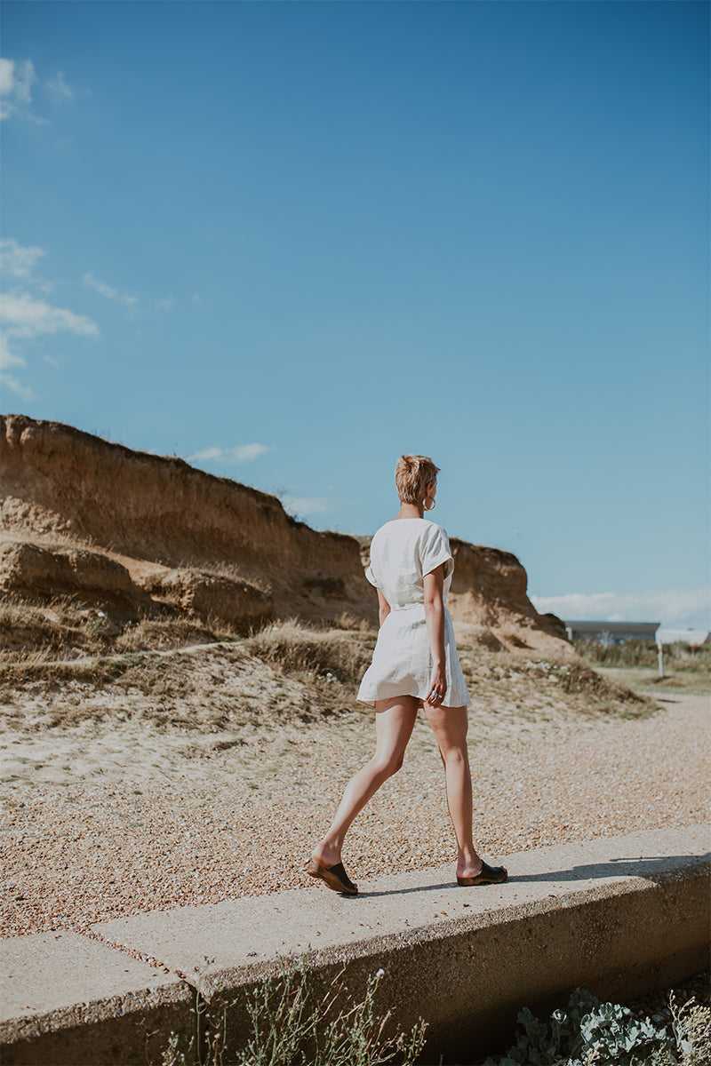 girl wears onyx black low heel clog sandal