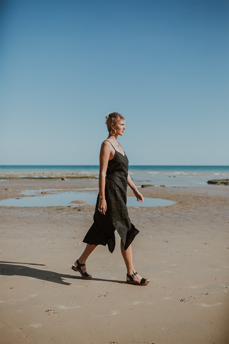 girl wears onyx black low heel single strap clog sandal