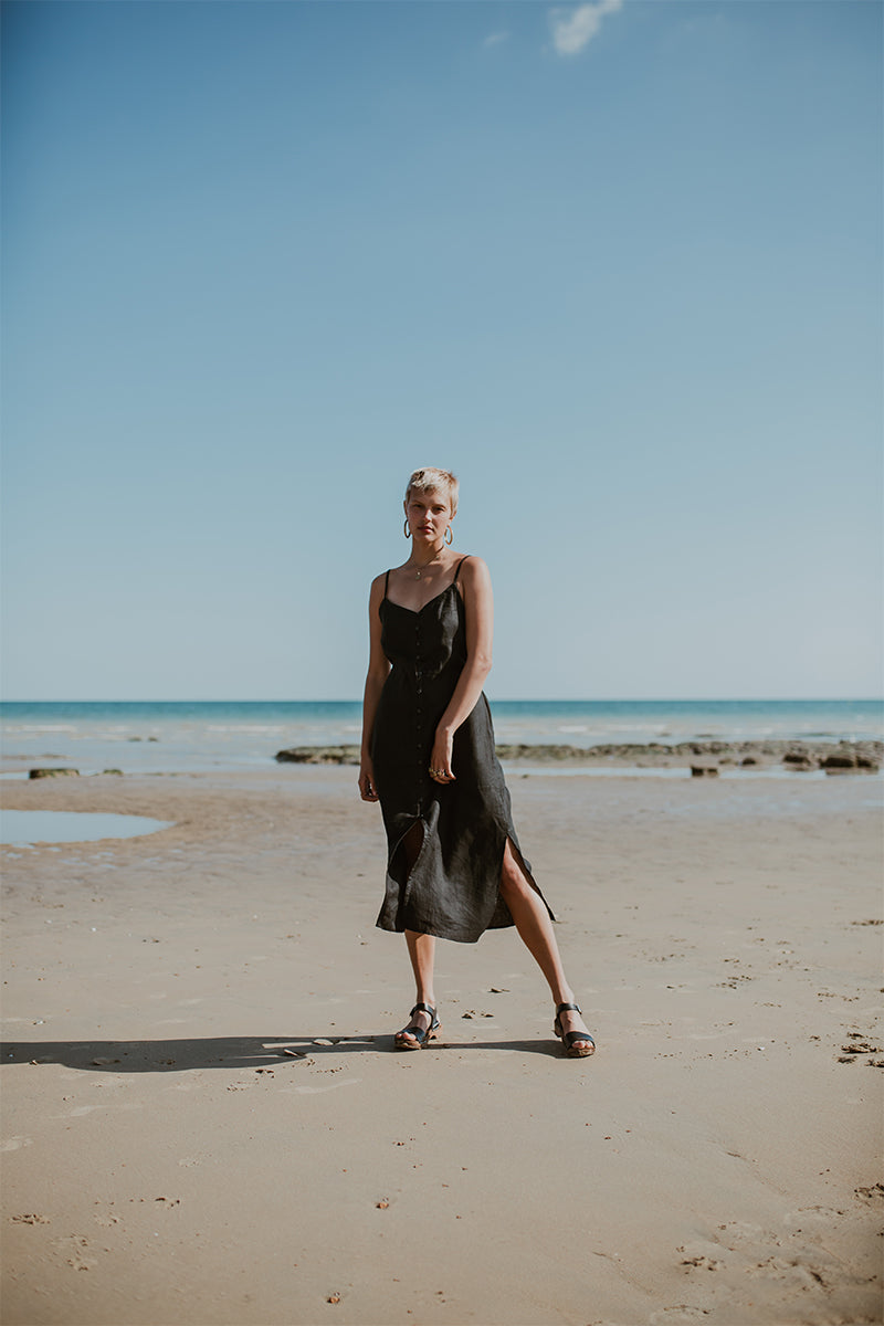 girl wears onyx black low heel single strap clog sandal