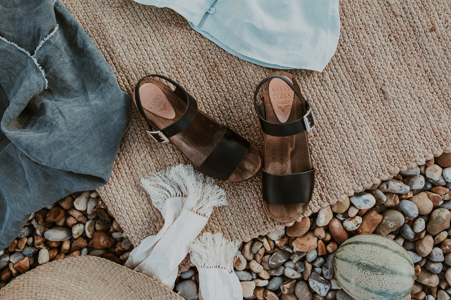 girl wears onyx black low heel single strap clog sandal