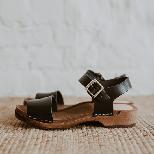 onyx black low heel single strap clog sandal