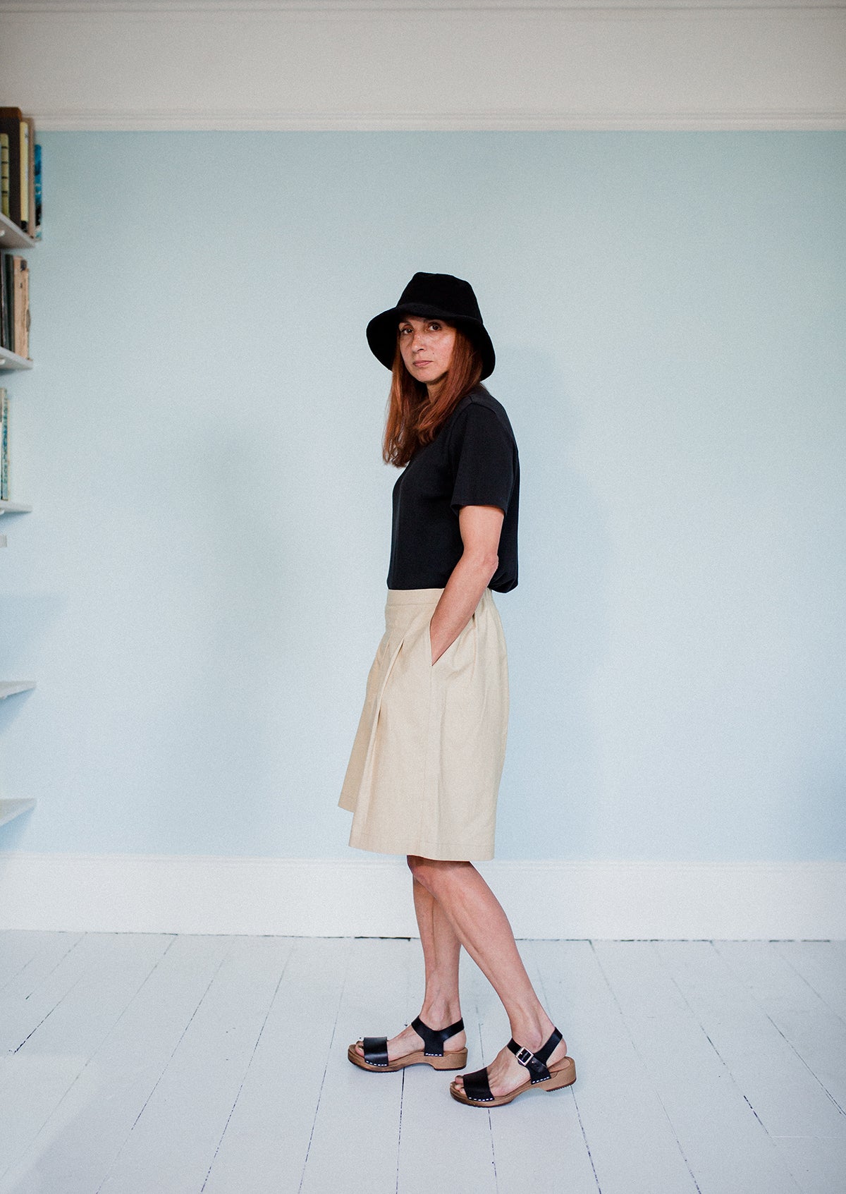 girl wears onyx black low heel single strap clog sandal