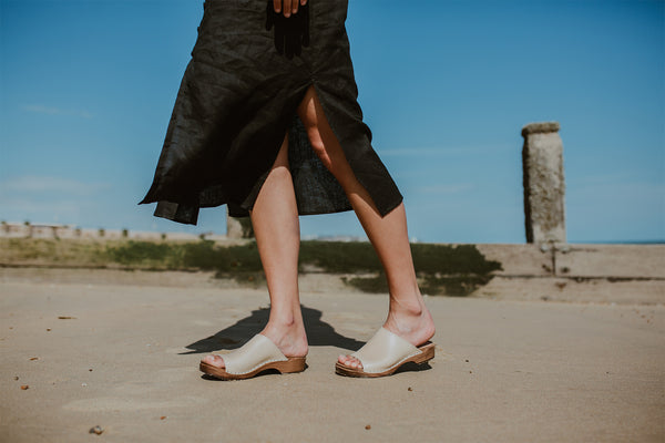 girl wears stone beige low heel clog sandal
