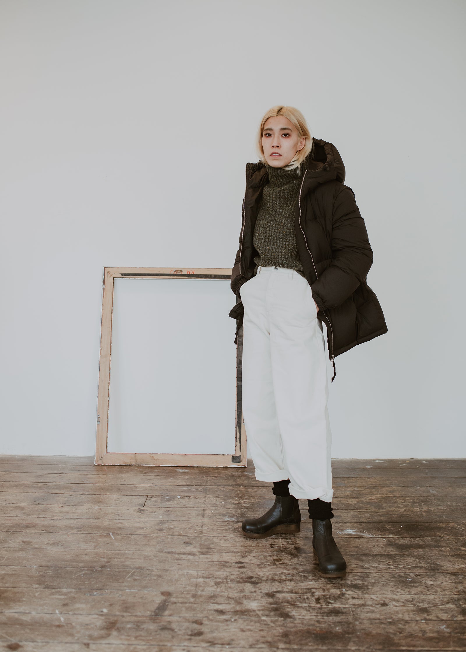 Girl wears Puffa coat and wide jeans with Black leather chelsea clog boot with flex sole