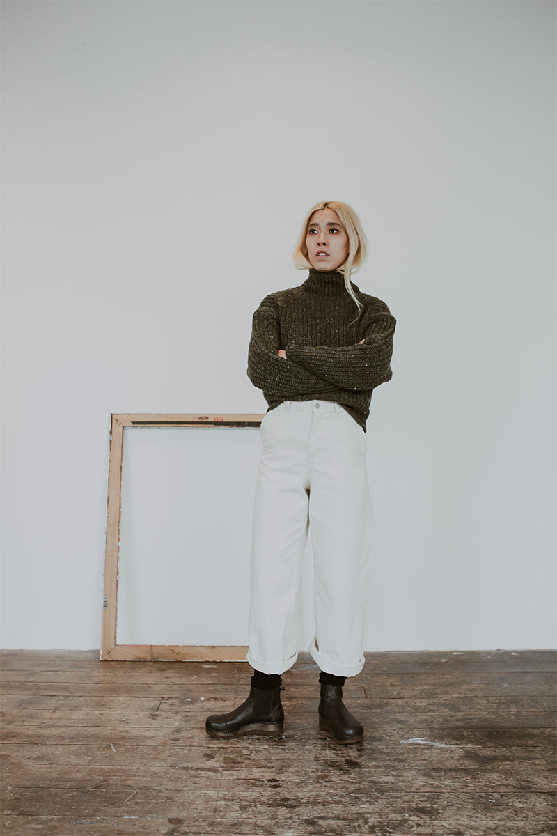 Roll neck chunky jumper and wide jeans with Black leather chelsea clog boot with flex sole