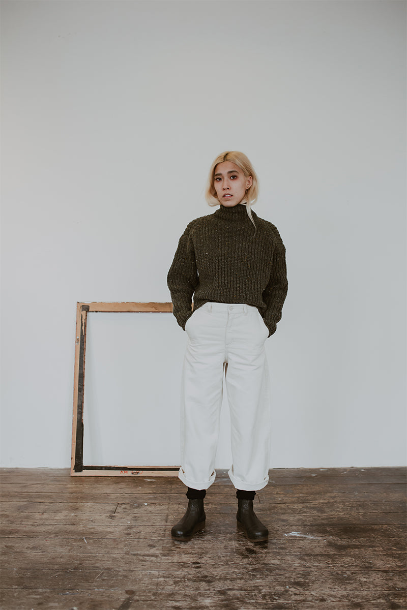 Roll neck chunky jumper and wide jeans with Black leather chelsea clog boot with flex sole