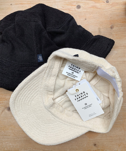 thing fabrics black towelling bucket hat and ecru cap